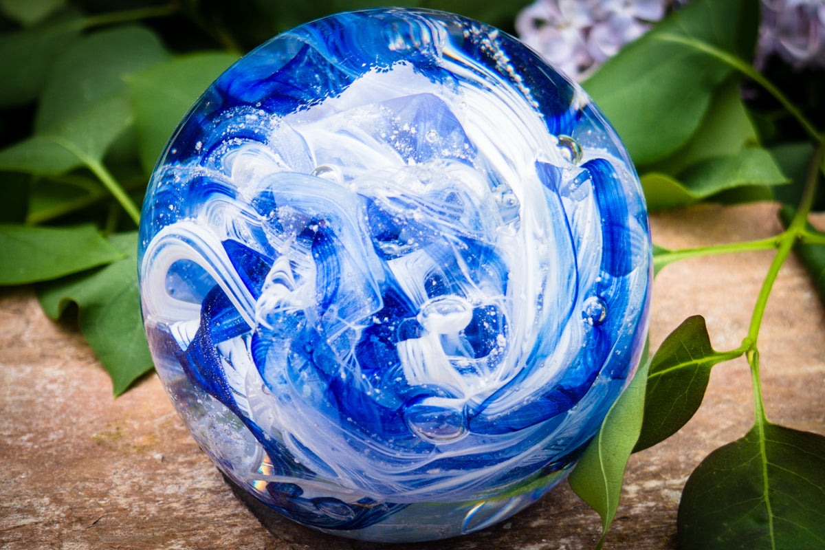 Ashes in glass orb for rememberance of people and pets