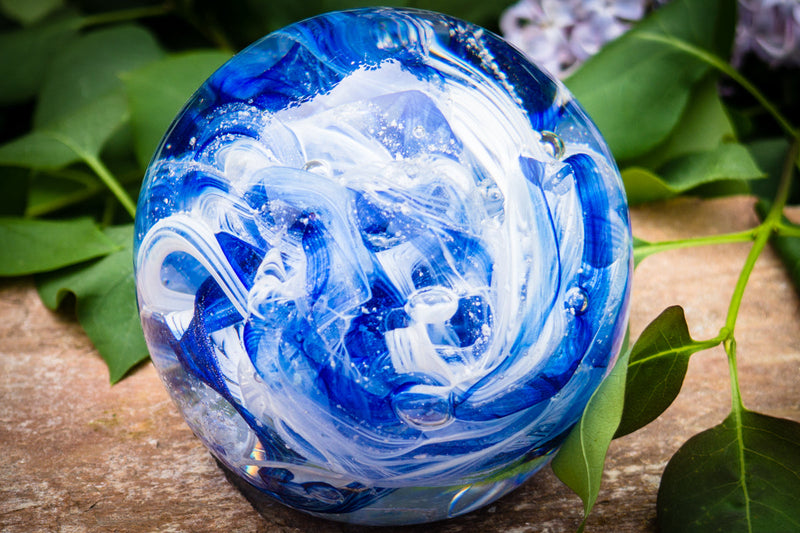 Ashes in glass orb for rememberance of people and pets