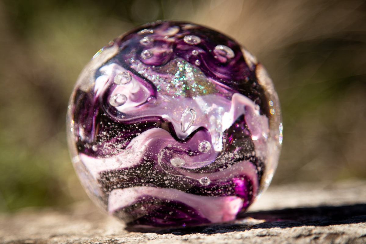 Glass orbs with cremation ash