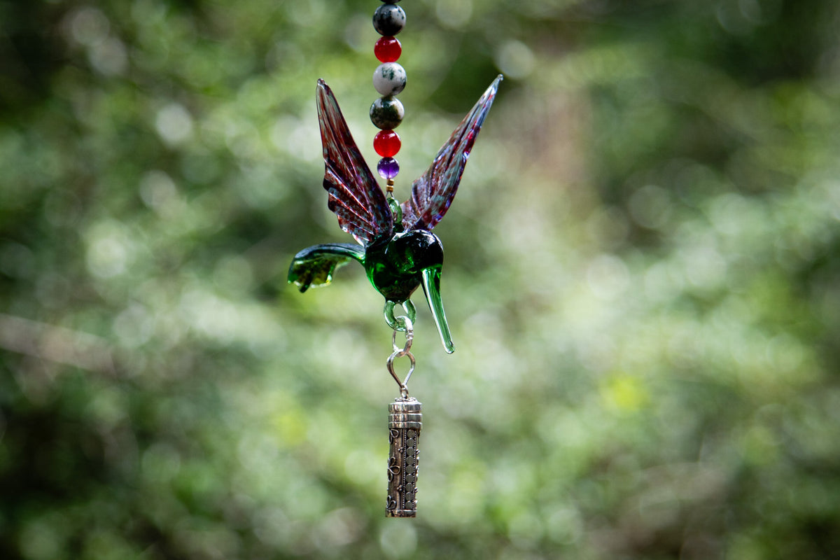 hummingbird with silver keepsake pendant